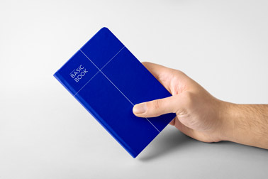 Hand Holding a Hardcover Notebook