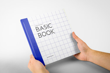 Hand Holding a Square Hardcover Book