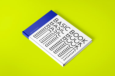 Tilted Hardcover Book on a Green Surface