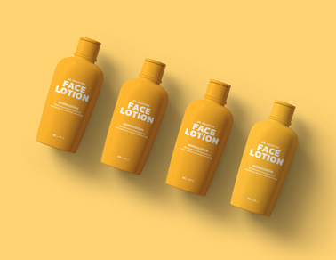 Four Lotion Bottles on a Yellow Background