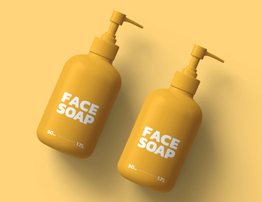 Two Pump Bottles on a Yellow Surface
