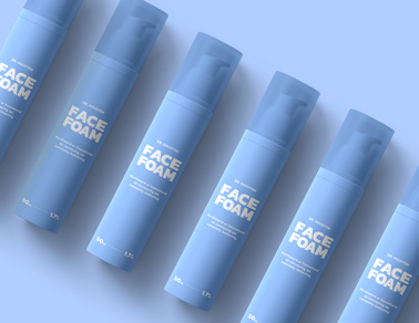 Six Airless Pump Bottles on a Blue Surface