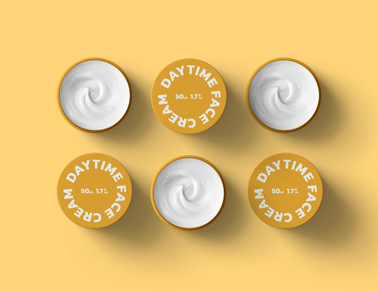 Six Open and Closed Cream Containers