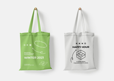 Two Tote Bags on a White Surface