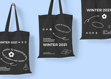 Three Tote Bags on a Blue Surface