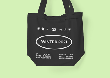 Zoomed Tote Bag on a Green Surface