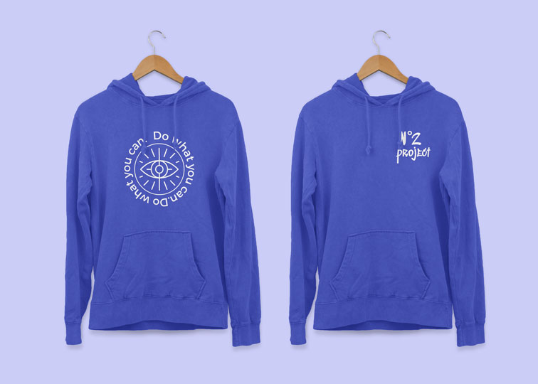 Two Hoodies Hanging on Wooden Hangers