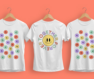 Three Hanging T-shirts on a Coral Background