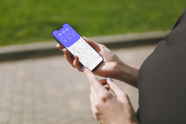 A Hand Holding an iPhone 13 Park Setting