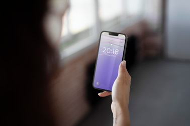 A Hand Holding an iPhone 13 Building Setting