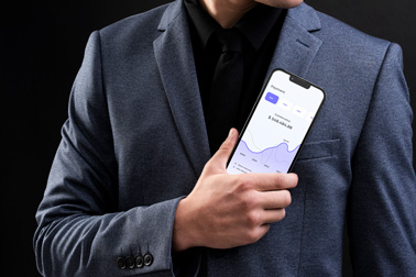 A Male Holding an iPhone 13 in His Hand 