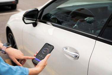 A Person Connecting iPhone 13 to Vehicle