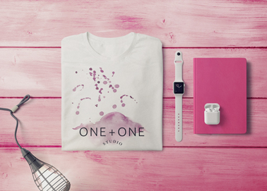 A T-shirt With a Watch, a Notebook, and Earphones