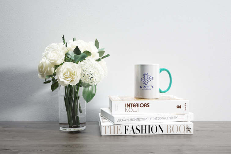 Flowers Next to a Mug on Books