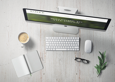 Tilted iMac With Coffee High Angle View