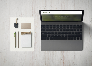 MacBook With Stationery on a White Desk