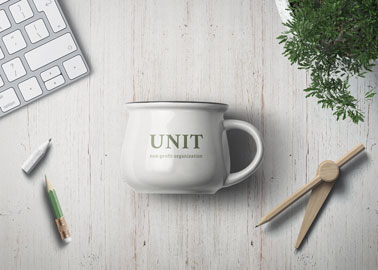 Ceramic Mug With Stationery and a Plant