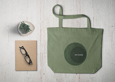 Tote Bag With Glasses, a Notebook, and a Plant