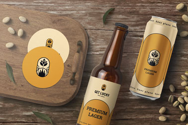 Beer Bottle and a Can Next to a Tray