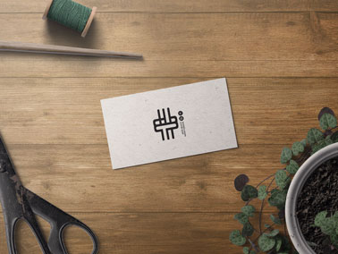 Business Card With a Plant and Scissors