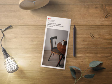 Brochure With a Lamp on a Wooden Table