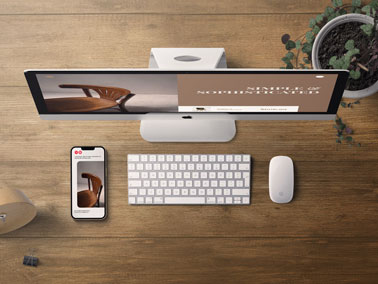 iMac With a Cell Phone on a Wooden Table 