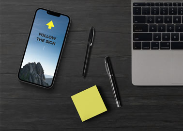 iPhone With Pens and Sticky Notes