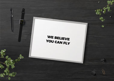 Picture Frame With a Watch on a Black Surface