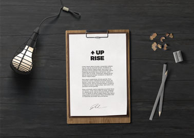 Notepad With a Lamp and Pencils