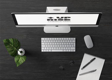 iMac With Stationery on a Black Surface