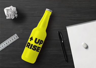 Drink Bottle With Stationery on a Black Table
