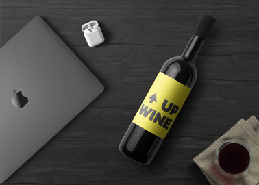 Wine Bottle With AirPods and an iMac