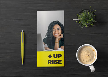 Brochure With a Pen and a Coffee Cup