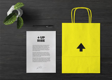 Paper Bag With a Plant, a Pen, and Paper