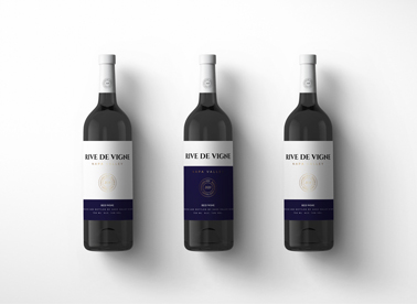 Zoomed-out Three Red Wine Bottles