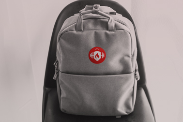 Backpack on a Chair Against the Wall