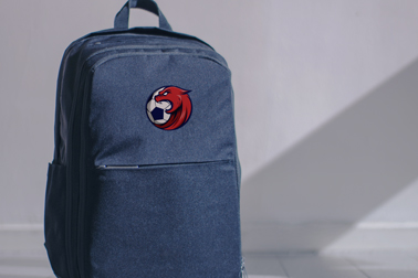 Denim Backpack on the White Floor