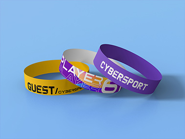 Three Paper Wristbands Placed on Top of Each Other