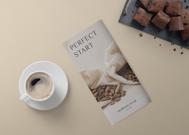 Closed Brochure With a Cup of Coffee