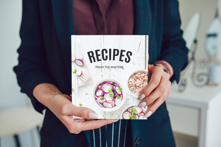 Female Hands Showing a Book