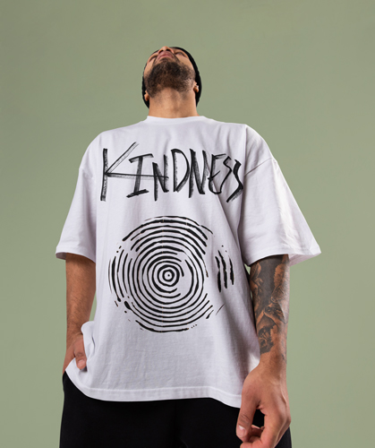 Man Looking Up Wearing an Oversized Shirt 