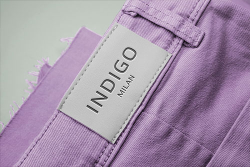 Apparel Tag on Purple Fabric