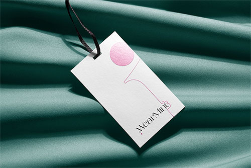 Clothing Tag on Green Fabric