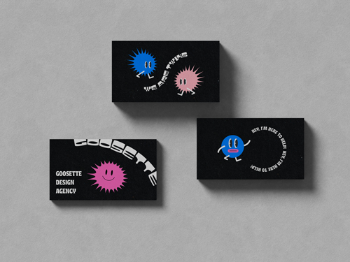 Three Business Cards on a Grey Surface