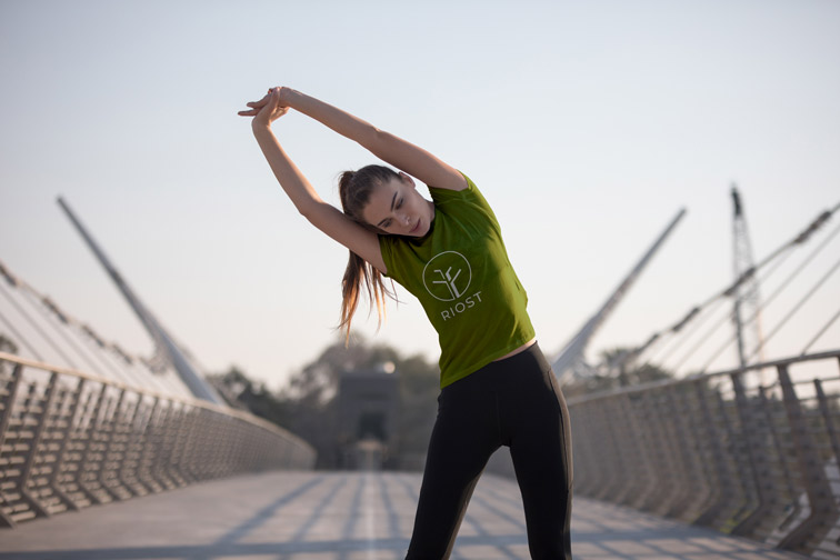 Girl Stretching on a Bridge