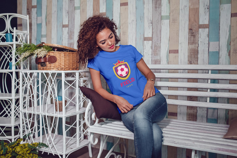 Girl Sitting and Looking at Her T-shirt