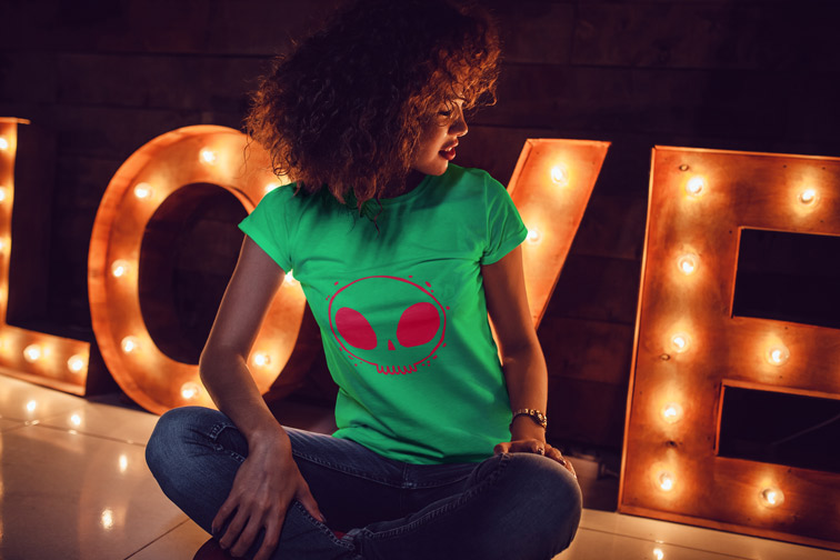 Girl Sitting and Looking at Letter Lights