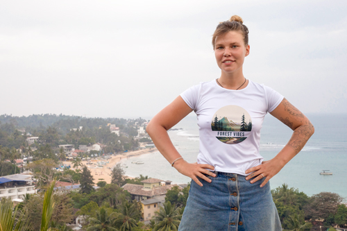 Woman in T-shirt with Hands on Her Hips