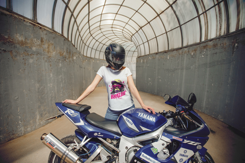 Woman in a T-shirt with a Motorbike