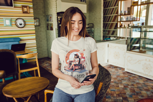 Woman in a T-shirt Smiling at the Phone